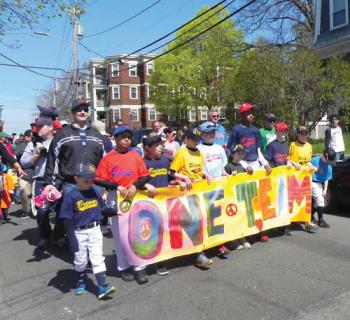 Savin Hill Little League players and their coaches paraded to McConnell Park on Saturday. 	Photo by Paige Buckley